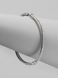 From the Silver Ice Crossover Collection. A twisted cable crisscrosses a diamond band in this graceful bangle of sterling silver and 14k white gold. Diamonds, 0.49 tcw Sterling silver and 14k white gold Diameter, about 2¼ Made in USA From the Silver Ice Crossover Collection. A twisted cable crisscrosses a diamond band in this graceful bangle of sterling silver and 14k white gold. Diamonds, 0.49 tcw Sterling silver and 14k white gold Diameter, about 2¼ Made in USA