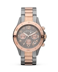 Rock MARC BY MARC JACOBS' style around the clock. This bold, plated metal watch flaunts an opulent look with chronograph movement, three-eye dial, and classic link bracelet. Rock MARC BY MARC JACOBS' style around the clock. This bold, plated metal watch flaunts an opulent look with chronograph movement, three-eye dial, and classic link bracelet.