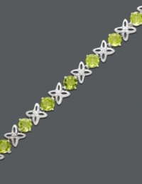 Wrap your wrist in kisses and hugs. Sterling silver X's and round-cut peridot O's (8-1/2 ct. t.w.) alternate for an bracelet that will make others green with envy. Approximate length: 7 inches. Wrap your wrist in kisses and hugs. Sterling silver X's and round-cut peridot O's (8-1/2 ct. t.w.) alternate for an bracelet that will make others green with envy. Approximate length: 7 inches.