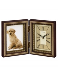 A traditionally handsome desk clock and the perfect frame for your memories, by Seiko. Dark brown wooden case features clock at right and frame at left, both covered in glass crystal. Battery included. Measures approximately 6 1/4 X 5 X 2 3/4. A traditionally handsome desk clock and the perfect frame for your memories, by Seiko. Dark brown wooden case features clock at right and frame at left, both covered in glass crystal. Battery included. Measures approximately 6 1/4 X 5 X 2 3/4.