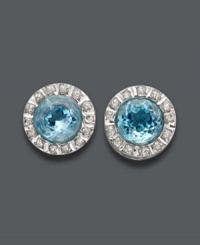 A stunning style in a pale blue hue. Round-cut blue topaz gemstones (6 ct. t.w.) shine amidst circles of sparkling diamond accents. Post setting crafted in 14k white gold. Approximate diameter: 6/16 inch. A stunning style in a pale blue hue. Round-cut blue topaz gemstones (6 ct. t.w.) shine amidst circles of sparkling diamond accents. Post setting crafted in 14k white gold. Approximate diameter: 6/16 inch.