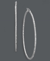 Extra large hoops make for red-carpet worthy style. Sparkling diamond accents add shimmer to a large sterling silver setting. Approximate diameter: 2-1/4 inches. Extra large hoops make for red-carpet worthy style. Sparkling diamond accents add shimmer to a large sterling silver setting. Approximate diameter: 2-1/4 inches.