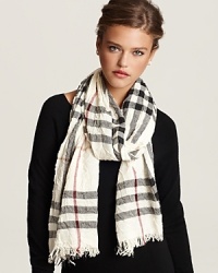 Burberry ups the glam factor with this check scarf in crinkled fabric with fringe trim. Let the signature pattern and luxurious proportions transform your look. Burberry ups the glam factor with this check scarf in crinkled fabric with fringe trim. Let the signature pattern and luxurious proportions transform your look.
