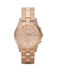 Opt for of-the-moment chic with this softly glowing rose gold watch with three-eye design and date display from MARC BY MARC JACOBS. Opt for of-the-moment chic with this softly glowing rose gold watch with three-eye design and date display from MARC BY MARC JACOBS.