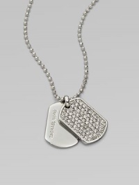 Glittering pavé: stones set in an edgy dog tag pendant on a ball chain. Cubic zirconia and glass stonesSilvertone metalLength, about 18Pendant size, about .75Toggle closure with logo charmImported 