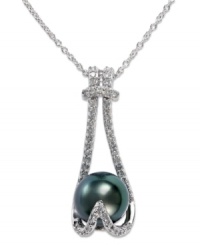 Stun them with sparkle. EFFY Collection's beautiful pendant showcases a cultured Tahitian freshwater pearl (9-9-1/2 mm) cradled by round-cut diamonds (1/4 ct. t.w.) in 14k white gold. Approximate length: 18 inches. Approximate drop: 1 inch. Stun them with sparkle. EFFY Collection's beautiful pendant showcases a cultured Tahitian freshwater pearl (9-9-1/2 mm) cradled by round-cut diamonds (1/4 ct. t.w.) in 14k white gold. Approximate length: 18 inches. Approximate drop: 1 inch.