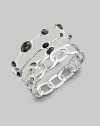 From the Rock Candy Collection. Faceted onyx stones lay stationary along a thin sterling silver band.Onyx Sterling silver Diameter, about 2½ x 2¼ Imported Please note: Bracelets sold separately. 