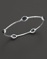 From the Silver collection, five black onyx stations on a hammered bangle in sterling silver. Designed by Ippolita. From the Silver collection, five black onyx stations on a hammered bangle in sterling silver. Designed by Ippolita.