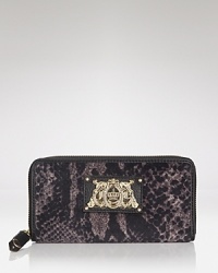 Wildly practical: this Juicy Couture wallet adds tactile interest to your everyday essentials, crafted of velour with multiple interior compartments. Wildly practical: this Juicy Couture wallet adds tactile interest to your everyday essentials, crafted of velour with multiple interior compartments.