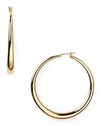 Timeless and poised, ABS by Allen Schwartz's gold hoop earrings are essential to any jewel box. The curvaceous baubles add versatile shine to staple tees or after hours ensembles. Timeless and poised, ABS by Allen Schwartz's gold hoop earrings are essential to any jewel box. The curvaceous baubles add versatile shine to staple tees or after hours ensembles.