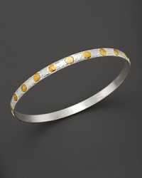 A beautiful bangle from Gurham, crafted with hammered white silver with 24 Kt. yellow gold stud accents. A beautiful bangle from Gurham, crafted with hammered white silver with 24 Kt. yellow gold stud accents.