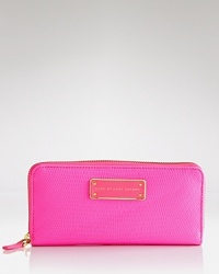 This everyday MARC BY MARC JACOBS style is anything but basic, finished with an enamel logo plate. Its zip around closure opens to a lined interior with 8 credit card pockets. This everyday MARC BY MARC JACOBS style is anything but basic, finished with an enamel logo plate. Its zip around closure opens to a lined interior with 8 credit card pockets.