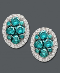 Vibrant blues and a hint of sparkle, too! Bella Bleu by Effy Collection's stud earrings feature round-cut blue diamonds at center (3/4 ct. t.w.) surrounded by a halo of sparkling white diamond (1/5 ct. t.w.). Crafted in 14k white gold. Approximate size: 1/4 inch x 1/2 inch. Vibrant blues and a hint of sparkle, too! Bella Bleu by Effy Collection's stud earrings feature round-cut blue diamonds at center (3/4 ct. t.w.) surrounded by a halo of sparkling white diamond (1/5 ct. t.w.). Crafted in 14k white gold. Approximate size: 1/4 inch x 1/2 inch.