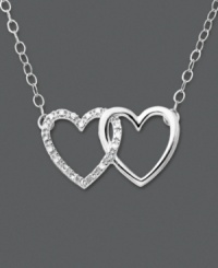 Tell her how she's captured your heart. This heart necklace features two interlocking hearts set in 14k white gold. One heart has been dusted in round-cut diamond accents. Approximate length: 16 inches. Approximate drop: 3/8 inch. Tell her how she's captured your heart. This heart necklace features two interlocking hearts set in 14k white gold. One heart has been dusted in round-cut diamond accents. Approximate length: 16 inches. Approximate drop: 3/8 inch.
