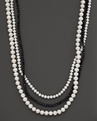 A beautiful blend of fresh water pearl in two sizes and a nested strand of black onyx beads. A beautiful blend of fresh water pearl in two sizes and a nested strand of black onyx beads.