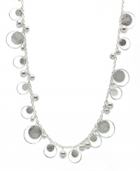 Going around in circles takes on a fashionable new meaning, thanks to Style&co.'s paillette sandblast necklace with beaded embellishments. Made in silver tone mixed metal. Approximate length: 36 inches. Going around in circles takes on a fashionable new meaning, thanks to Style&co.'s paillette sandblast necklace with beaded embellishments. Made in silver tone mixed metal. Approximate length: 36 inches.