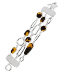 Tortoise-look beads add a chic finish to this three-row bracelet from Robert Lee Morris. Finished with a toggle closure. Crafted in silver tone mixed metal. Approximate length: 7-1/2 inches. Tortoise-look beads add a chic finish to this three-row bracelet from Robert Lee Morris. Finished with a toggle closure. Crafted in silver tone mixed metal. Approximate length: 7-1/2 inches.