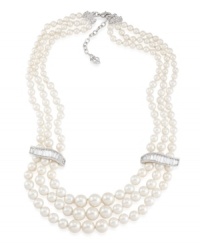 Let elegance define your look. Carolee's stunning three-row necklace features glass pearls accented by sparkling glass spacers. Set in silver tone mixed metal. Approximate length 18 inches + 2-inch extender. Let elegance define your look. Carolee's stunning three-row necklace features glass pearls accented by sparkling glass spacers. Set in silver tone mixed metal. Approximate length 18 inches + 2-inch extender.