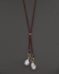 Boldly gleaming baroque freshwater pearls add rich luster to 14K yellow gold and leather. By Nancy B. Boldly gleaming baroque freshwater pearls add rich luster to 14K yellow gold and leather. By Nancy B.