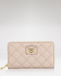 Pull off the posh, pretty, and practical look with this leather wallet from Marc Jacobs. Crafted from quilted leather and accented with the brand's signature hardware, it's an essential no fashion girl should be without. Pull off the posh, pretty, and practical look with this leather wallet from Marc Jacobs. Crafted from quilted leather and accented with the brand's signature hardware, it's an essential no fashion girl should be without.