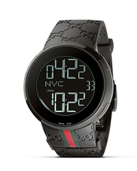From the I-Gucci collection, a modern timepiece. Black bezel casing frames a round black dial that offers the option of a digital or analog display. White digits represent hour, minute, second, date and your location. Black rubber strap with red/green webbing accent. Triple deployment buckle. From the I-Gucci collection, a modern timepiece. Black bezel casing frames a round black dial that offers the option of a digital or analog display. White digits represent hour, minute, second, date and your location. Black rubber strap with red/green webbing accent. Triple deployment buckle.