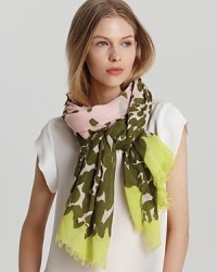 A sheer oblong scarf with a painterly animal print and neon border ends. A sheer oblong scarf with a painterly animal print and neon border ends.