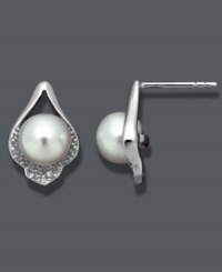 Define your style with subtle studs. Crafted in sterling silver, these petite, cultured freshwater pearls (7-8 mm) shine in a diamond-accented, sterling silver teardrop setting. Approximate diameter: 1/2 inch. Define your style with subtle studs. Crafted in sterling silver, these petite, cultured freshwater pearls (7-8 mm) shine in a diamond-accented, sterling silver teardrop setting. Approximate diameter: 1/2 inch.