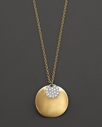 This gold concave dip medallion necklace is paired with a diamond pavé medallion. Designed by Meira T. This gold concave dip medallion necklace is paired with a diamond pavé medallion. Designed by Meira T.