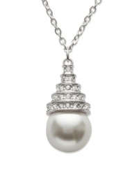 Let seaside style wash over your neckline. This summery-fresh pendant by Swarovski highlights a white crystal pearl drop accented by clear crystal pavé. Set in silver tone mixed metal. Approximate length: 15 inches. Approximate drop: 3/4 inch. Let seaside style wash over your neckline. This summery-fresh pendant by Swarovski highlights a white crystal pearl drop accented by clear crystal pavé. Set in silver tone mixed metal. Approximate length: 15 inches. Approximate drop: 3/4 inch.