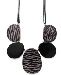 A little bit fierce, a whole lot fashionista! Style&co.'s statement-making necklace features chunky jet and zebra glitter resin beads, silver tone mixed metal beaded accents and clasp and a tripled black wax cord. Approximate length: 19-1/2 inches + 2-inch extender. Approximate drop: 3-1/2 to 4-1/2 inches. A little bit fierce, a whole lot fashionista! Style&co.'s statement-making necklace features chunky jet and zebra glitter resin beads, silver tone mixed metal beaded accents and clasp and a tripled black wax cord. Approximate length: 19-1/2 inches + 2-inch extender. Approximate drop: 3-1/2 to 4-1/2 inches.