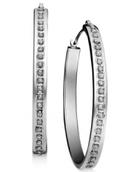 Get star-studded style with standout hoops. Crafted in 14k white gold, a seamless row of sparkling diamond accents give these earrings red carpet appeal. Approximate diameter: 1-1/4 inches. Get star-studded style with standout hoops. Crafted in 14k white gold, a seamless row of sparkling diamond accents give these earrings red carpet appeal. Approximate diameter: 1-1/4 inches.