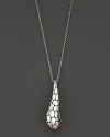 A beautifully textured silver drop is elegant suspended from a gleaming chain.