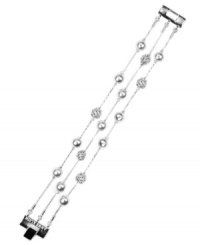 Strand together your perfect look with AK Anne Klein's flaunt-worthy flex bracelet. Crafted in imitation rhodium-plated mixed metal, it's adorned with glass pearls and crystal pave ball accents. Approximate length: 7-1/2 inches. Strand together your perfect look with AK Anne Klein's flaunt-worthy flex bracelet. Crafted in imitation rhodium-plated mixed metal, it's adorned with glass pearls and crystal pave ball accents. Approximate length: 7-1/2 inches.