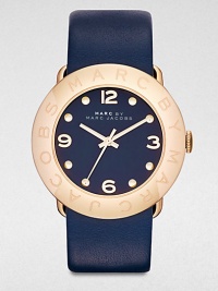 A radiant goldtone ion-plated stainless steel design with a supple leather strap. Quartz movementWater resistant to 5 ATMRound goldtone ion-stainless steel case, 36mm (1.4)Logo engraved bezelNavy dialDot and numeric hour markersSecond hand Navy leather strapImported A radiant goldtone ion-plated stainless steel design with a supple leather strap. Quartz movementWater resistant to 5 ATMRound goldtone ion-stainless steel case, 36mm (1.4)Logo engraved bezelNavy dialDot and numeric hour markersSecond hand Navy leather strapImported