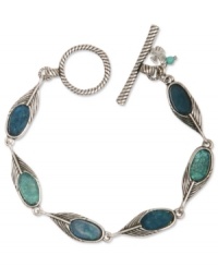 Flaunt what you've got. Lucky Brand's peacock-inspired bracelet combines semi-precious reconstituted calcite turquoise with feather charms. Set in silver tone mixed metal. Approximate length: 7-3/4 inches. Flaunt what you've got. Lucky Brand's peacock-inspired bracelet combines semi-precious reconstituted calcite turquoise with feather charms. Set in silver tone mixed metal. Approximate length: 7-3/4 inches.