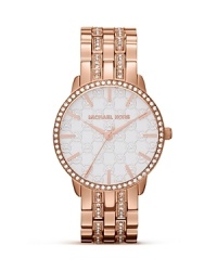Michael Kors' mixes classic style with just-right glitz on this gorgeously-styled timepiece. Cast in rose gold and embellished with crystals and a Mother-of-Pearl face, it's one to watch. Michael Kors' mixes classic style with just-right glitz on this gorgeously-styled timepiece. Cast in rose gold and embellished with crystals and a Mother-of-Pearl face, it's one to watch.