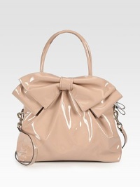 Lustrous patent leather in a roomy carryall, topped with a chic oversized bow.Double top handles, 5¼ dropDetachable shoulder strap, 15 dropTop zip closureProtective metal feetOne inside zip pocketTwo inside open pocketsCotton lining12¾W X 9½H X 4½DMade in Italy Lustrous patent leather in a roomy carryall, topped with a chic oversized bow.Double top handles, 5¼ dropDetachable shoulder strap, 15 dropTop zip closureProtective metal feetOne inside zip pocketTwo inside open pocketsCotton lining12¾W X 9½H X 4½DMade in Italy