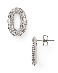 Crafted from rhodium plated metal and crystal stations, Nadri's open link hoop earrings encapsulate sophisticated accessorizing. Wear them to pull together your evening look. Crafted from rhodium plated metal and crystal stations, Nadri's open link hoop earrings encapsulate sophisticated accessorizing. Wear them to pull together your evening look.