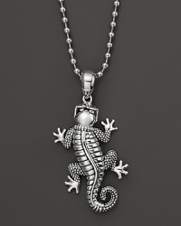 A sunglasses-adorned gecko dangles from a sterling silver ball chain on this everyday necklace from Lagos. A sunglasses-adorned gecko dangles from a sterling silver ball chain on this everyday necklace from Lagos.