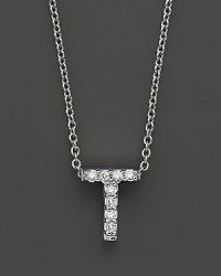 From the Tiny Treasures collection, a diamond T necklace. With signature ruby accent. Designed by Roberto Coin. From the Tiny Treasures collection, a diamond T necklace. With signature ruby accent. Designed by Roberto Coin.