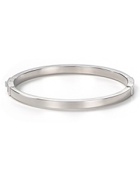 Keep it simple: MICHAEL Michael Kors' silver bangle perfects refined polish at your wrist. Worn solo or stacked, the slim bracelet shines on for perennial chic. Keep it simple: MICHAEL Michael Kors' silver bangle perfects refined polish at your wrist. Worn solo or stacked, the slim bracelet shines on for perennial chic.