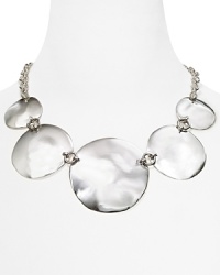 This striking Robert Lee Morris Soho necklace gathers luminous concave discs into an architectural statement piece, finished by a simple silver plated chain. This striking Robert Lee Morris Soho necklace gathers luminous concave discs into an architectural statement piece, finished by a simple silver plated chain.
