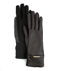 Add a handful of luxe Burberry style to your winter look with these lambskin leather and cashmere gloves. Add a handful of luxe Burberry style to your winter look with these lambskin leather and cashmere gloves.