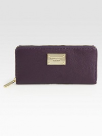 A strikingly bold hue and goldtone accents set this continental leather style apart from the rest.Zip around closure One inside zip pocket Credit card slots Cotton lining 8W X 4H X 1D Imported A strikingly bold hue and goldtone accents set this continental leather style apart from the rest.Zip around closure One inside zip pocket Credit card slots Cotton lining 8W X 4H X 1D Imported