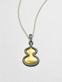 An elegant style featuring hammered 24k gold framed with darkened sterling silver on a link chain. Sterling silver24k goldLength, about 17.7Pendant size, about 1Lobster clasp closureImported 