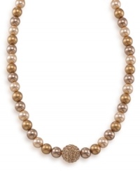 Classy with a hint of shimmer, this adjustable glass pearl necklace by Carolee adds an element of glamour. Comprised of gold glass pearls (8 mm) and a crystal coated fireball, necklace features a 12k gold-plated mixed metal setting. Approximate length: 16 inches + 2-inch extender. Classy with a hint of shimmer, this adjustable glass pearl necklace by Carolee adds an element of glamour. Comprised of gold glass pearls (8 mm) and a crystal coated fireball, necklace features a 12k gold-plated mixed metal setting. Approximate length: 16 inches + 2-inch extender.