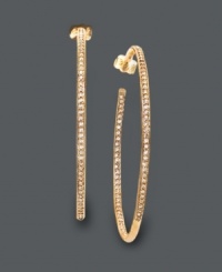 Step it up in the sparkle department. Glam hoops by Eliot Danori feature sparkling crystals in an in-and-out pattern. Crafted in 18k gold tone mixed metal. Approximate diameter: 2 inches. Step it up in the sparkle department. Glam hoops by Eliot Danori feature sparkling crystals in an in-and-out pattern. Crafted in 18k gold tone mixed metal. Approximate diameter: 2 inches.