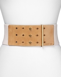 Structure sleek body-con silhouettes with this MICHAEL Michael Kors belt, combining edgy elastic and leather for serious waist-cinching that lets you breathe. Structure sleek body-con silhouettes with this MICHAEL Michael Kors belt, combining edgy elastic and leather for serious waist-cinching that lets you breathe.
