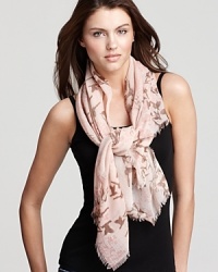 Flocks of birds and floral print decorate this elegant woven scarf from Fraas. Flocks of birds and floral print decorate this elegant woven scarf from Fraas.