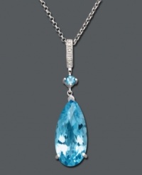 Dress up your evening wear with a bright splash of color. This elegant teardrop pendant features vibrant blue topaz (16-1/2 ct. t.w.) accented by sparkling diamonds. Crafted in sterling silver. Approximate length: 18 inches. Approximate drop: 2 inches. Dress up your evening wear with a bright splash of color. This elegant teardrop pendant features vibrant blue topaz (16-1/2 ct. t.w.) accented by sparkling diamonds. Crafted in sterling silver. Approximate length: 18 inches. Approximate drop: 2 inches.